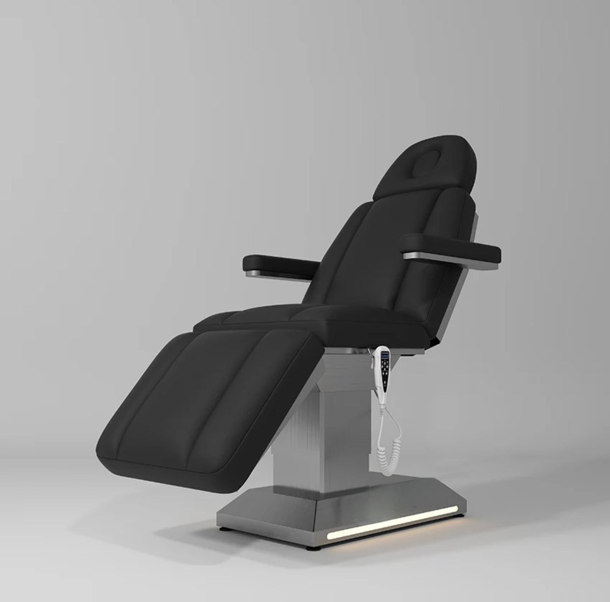 Black dental chair on a gray background beauty bed salon 