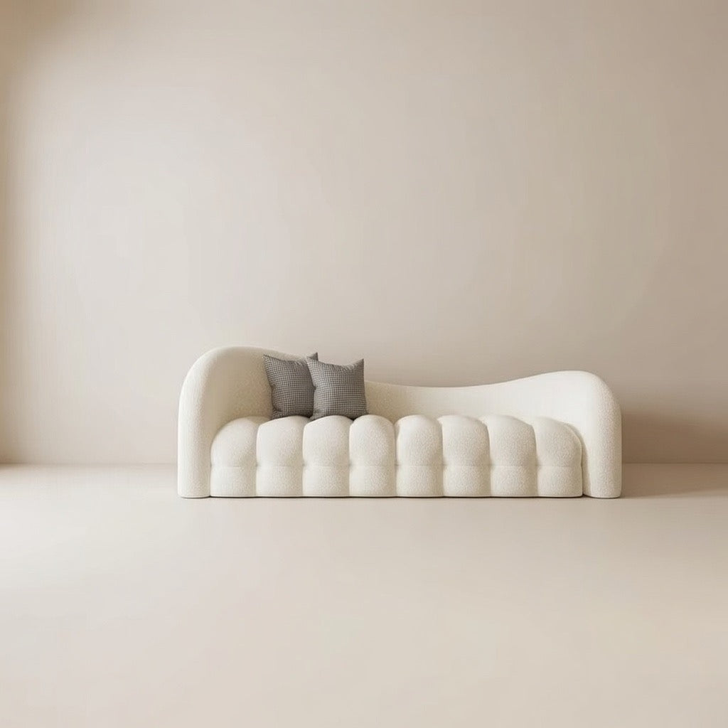 Modern white sofa with two gray cushions against a beige wall. Boucle salon furniture 