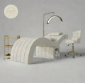 Modern white treatment bed with lamp and chair in a neutral setting beauty bed lash bed 