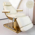 White and gold massage beauty bed in a minimalistic room